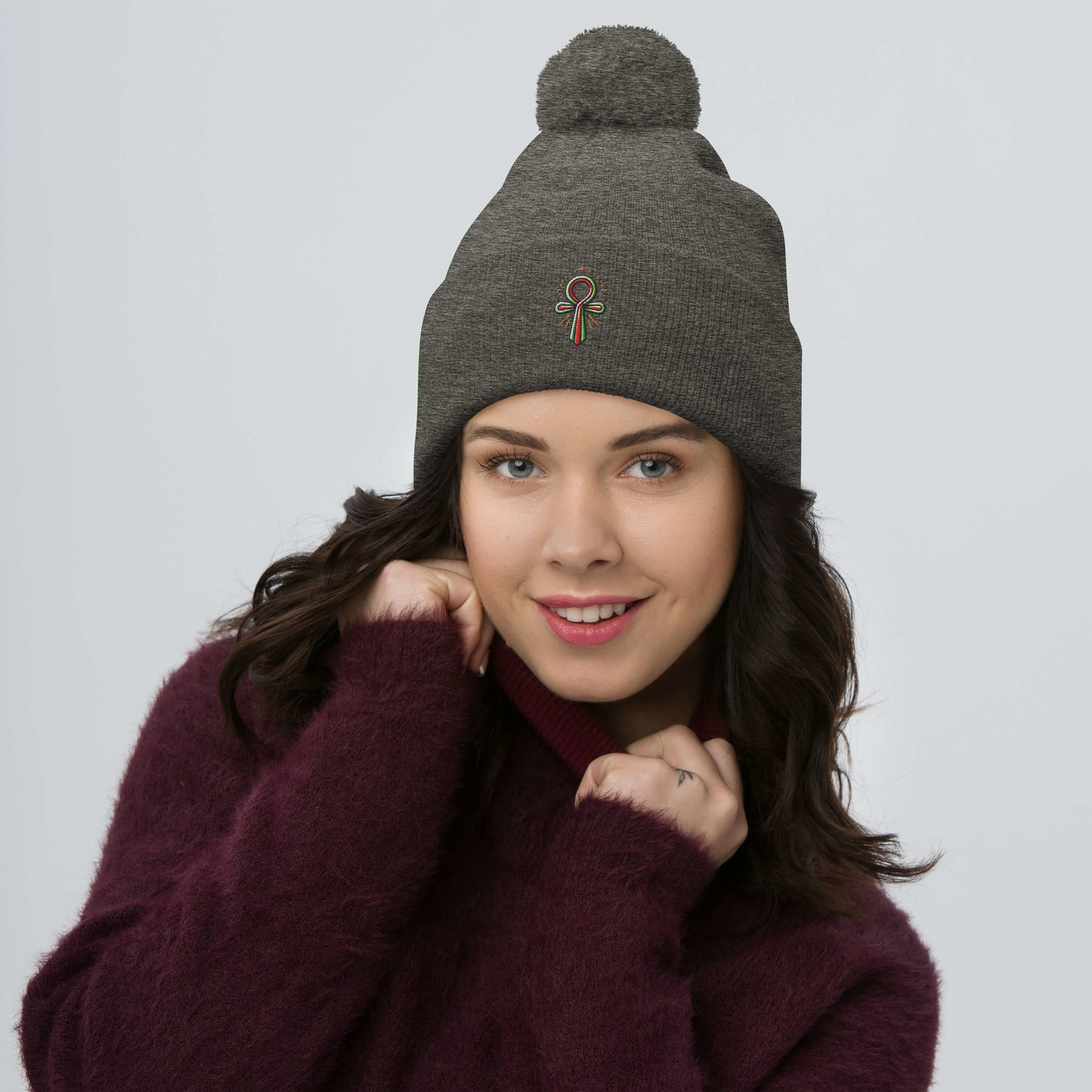 Pom-Pom Beanie with Ankh Charm – Stylish & Cozy pom-pom Refine Zone